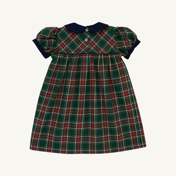The Dale Dress - Pinehill Plaid with Nantucket Navy by The Beaufort Bonnet Company is a short-sleeved, knee-length girls’ fall dress featuring a green, red, and white plaid pattern, accented with a Nantucket Navy collar and front buttons.