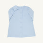 A child’s Dani Dress - Buckhead Blue Corduroy by The Beaufort Bonnet Company is shown from the back. This light blue corduroy dress features a row of buttons down the center and a large bow on the left shoulder, making it perfect for the holidays.