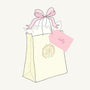 A pale yellow Happy Mystery Mail - Dolly Pack of 5 gift bag tied with a pink ribbon and a tag labeled dolly.