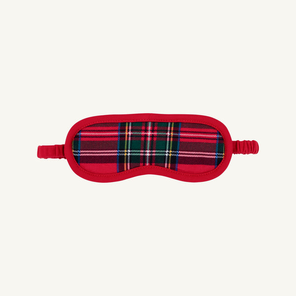 Dream More Mask - Society Prep Plaid sleep mask in a red, green, and blue plaid pattern with red trim, an elastic strap, and a Christmas charm.