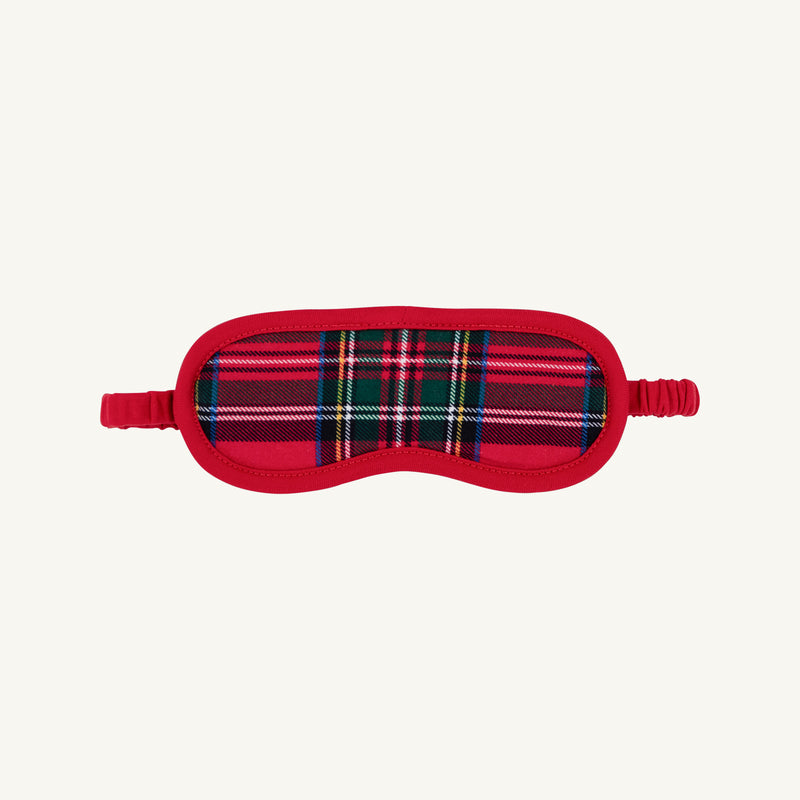 Dream More Mask - Society Prep Plaid sleep mask in a red, green, and blue plaid pattern with red trim, an elastic strap, and a Christmas charm.