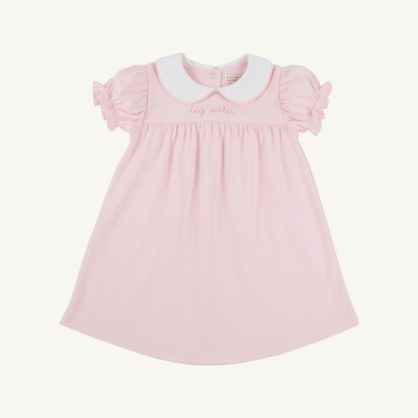 Holly Day Dress in Palm Beach Pink with Hamptons Hot Pink Big Sister embroidery, featuring a pink short-sleeved pima cotton design with a white Peter Pan collar.