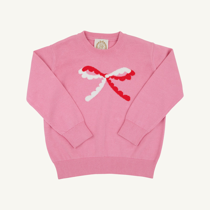 Isabelle’s Intarsia Sweater in Hamptons Hot Pink with a long-sleeved design, featuring a white and red scalloped bow on the front.