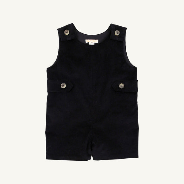 The Jack Keene Jon Jon - Newport Night Corduroy by The Beaufort Bonnet Company is a sleeveless toddler romper made from soft corduroy, featuring buttons on the shoulders and sides, plus two flap accents at the waist. Its cozy feel makes it a perfect holiday outfit, shown against a plain white background.