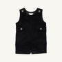 The Jack Keene Jon Jon - Newport Night Corduroy by The Beaufort Bonnet Company is a sleeveless toddler romper made from soft corduroy, featuring buttons on the shoulders and sides, plus two flap accents at the waist. Its cozy feel makes it a perfect holiday outfit, shown against a plain white background.