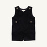 The Jack Keene Jon Jon - Newport Night Corduroy by The Beaufort Bonnet Company is a sleeveless toddler romper made from soft corduroy, featuring buttons on the shoulders and sides, plus two flap accents at the waist. Its cozy feel makes it a perfect holiday outfit, shown against a plain white background.