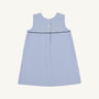 The Jill Jumper - Park City Periwinkle Stripe with Nantucket Navy is a sleeveless A-line piece in blue and white vertical stripes, featuring a dark blue horizontal trim and three buttons down the upper back.