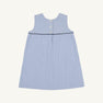The Jill Jumper - Park City Periwinkle Stripe with Nantucket Navy is a sleeveless A-line piece in blue and white vertical stripes, featuring a dark blue horizontal trim and three buttons down the upper back.