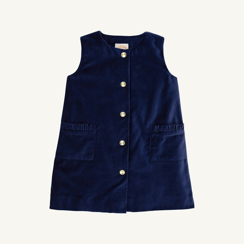 Navy blue Jilly Jumper - Nantucket Navy Velveteen sleeveless dress with a button-front closure and two front pockets with ruffled trim, perfect for a festive kids outfit.