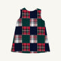 The Beaufort Bonnet Company Juliet Jumper - Mercer Island Madras is a sleeveless A-line jumper featuring a checkerboard pattern of solid dark green and red-and-white plaid squares.
