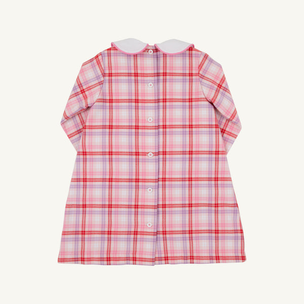 Back view of a Lindy’s Lunch Dress - Broadway Play Plaid with Worth Avenue White, a long-sleeved plaid holiday dress in shades of pink, red, and white, featuring a white rounded collar and a vertical row of buttons down the back.