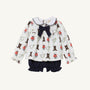 The Beaufort Bonnet Company’s Long Sleeve Banks Bow Bloomer Set – Happy Hunting with Palmetto Pearl & Nantucket Navy features a white long-sleeve top with a ruffled collar, playful horse and boot prints, a navy bow at the neckline, and matching navy ruffle bloomers. This adorable set is perfect as baby girl autumn clothing and makes a charming fall outfit.