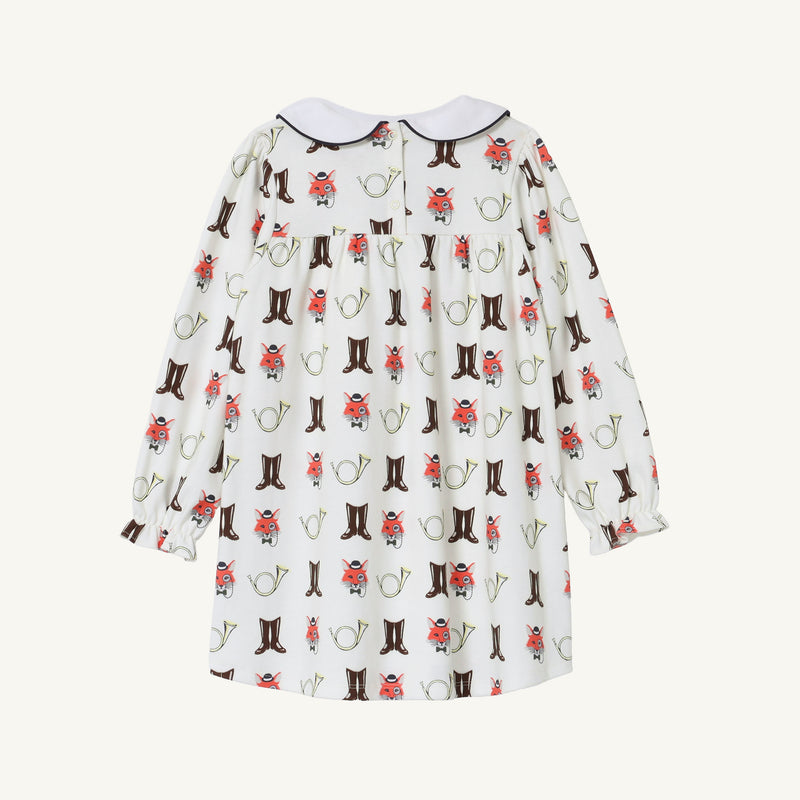 Long Sleeve Banks Bow Dress - Happy Hunting with Palmetto Pearl & Nantucket Navy by The Beaufort Bonnet Company, crafted from soft Pima cotton knit and featuring a playful print of brown boots, red flowers, and green watering cans. This charming fall dress has a rounded collar and is shown from the back.
