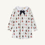 The Beaufort Bonnet Company’s Long Sleeve Banks Bow Dress - Happy Hunting with Palmetto Pearl & Nantucket Navy is crafted from soft Pima Cotton Knit. This long-sleeve white dress features a Nantucket Navy bow and an adorable print of cowboy boots, horseshoes, and red flowers. Finished with a Peter Pan collar detailed in dark trim, it’s the perfect fall dress for your little one.