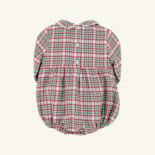The Beaufort Bonnet Company’s Long Sleeve Bradford Bubble in Wicker Park Plaid with Worth Avenue White features a classic red, green, and white plaid pattern, a Peter Pan collar, long sleeves, back button closure, and elastic leg openings—making it the perfect festive holiday outfit or timeless romper for baby boys.
