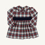 Long Sleeve Cindy Lou Sash Dress in Paris Pike Plaid with Nantucket Navy, featuring a Peter Pan collar and a solid navy sash at the waist, perfect for a girls’ holiday party.