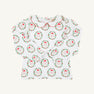 Long Sleeve Maude’s Peter Pan Collar Shirt - North Pole Portrait with Richmond Red by The Beaufort Bonnet Company: a children’s long-sleeve white shirt featuring a red-trimmed Peter Pan collar and a festive red and green Santa Claus wreath pattern, made from soft Pima cotton. The holiday outfit is laid flat on a plain background.
