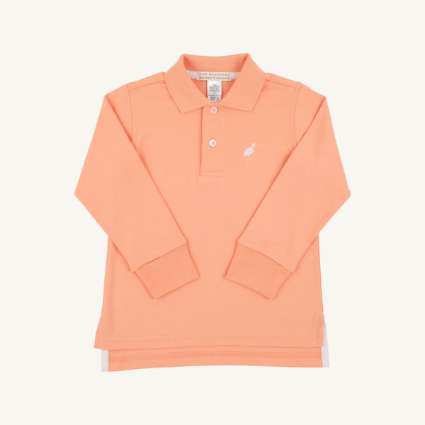The Long Sleeve Prim & Proper Polo by The Beaufort Bonnet Company, shown here in Seashore Sherbet with a multicolor stork embroidered on the left chest, features a classic collar, two-button placket, and is laid flat on a white background.