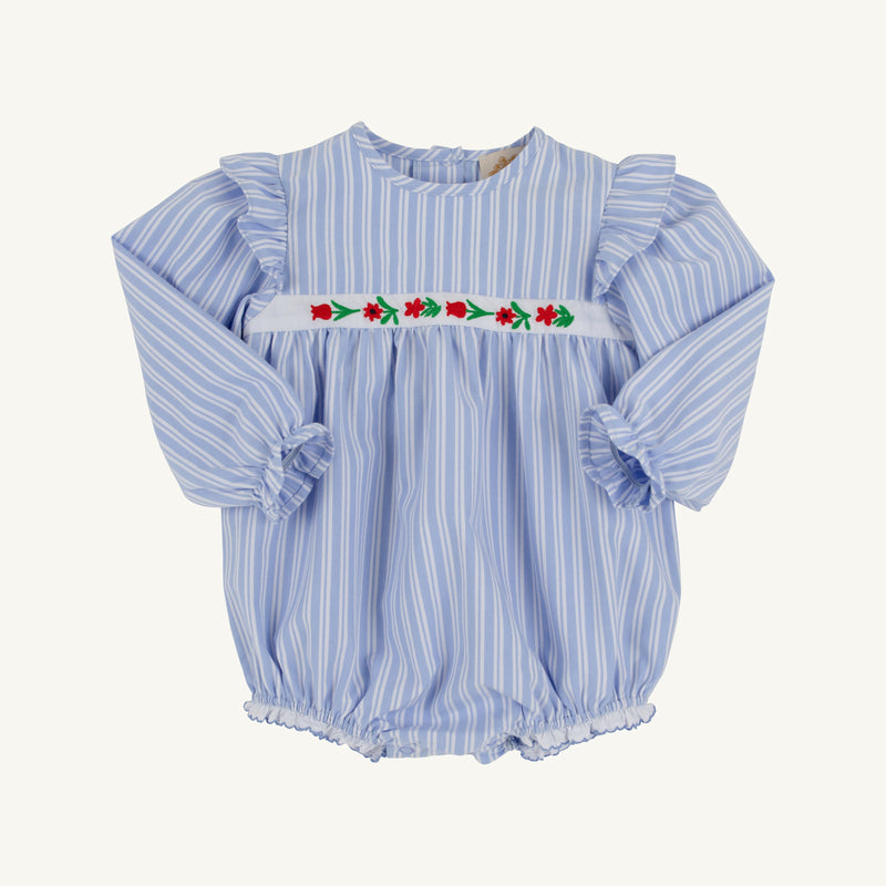 Long Sleeve Ruehling Ruffle Bubble - Park City Periwinkle Ticking Stripe & Worth Avenue White, a long-sleeve baby girl romper in a blue and white striped bubble style with ruffled shoulders and a white chest band embroidered with floral details.