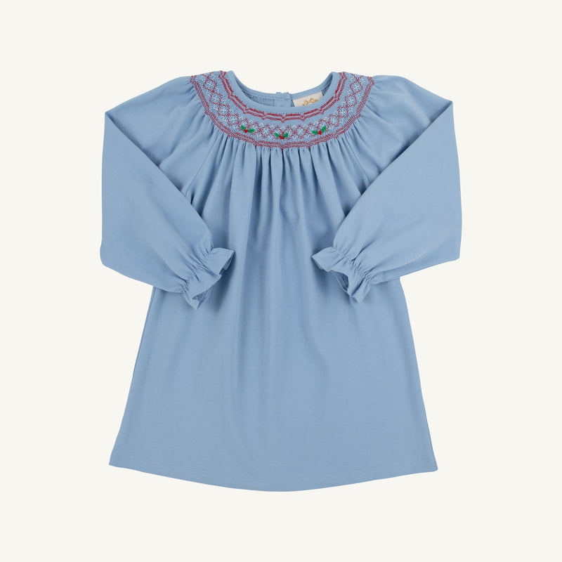 The Beaufort Bonnet Company Long Sleeve Sandy Smocked Dress in Barrington Blue with Richmond Red Holly features a smocked yoke with red and green embroidery, perfect for holiday parties.