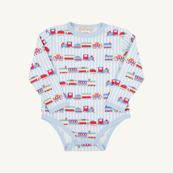 The Beaufort Bonnet Company’s Long Sleeve Walt Onesie - Choo Choo Coming Through with Buckhead Blue is a soft Pima cotton baby bodysuit, designed in a light blue shade and decorated with playful train and track motifs along vertical stripes, shown laid flat on a white background.