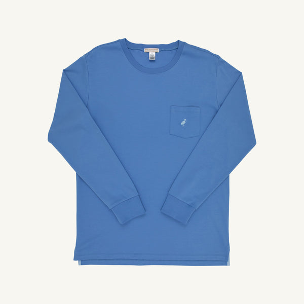 A Men’s Long Sleeve Carter Crewneck by The Beaufort Bonnet Company in Barbados Blue with a Beale Street Blue Stork, featuring a chest pocket with a small embroidered stork logo, is laid flat on a white background.