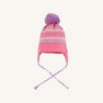 The Parrish Pom Pom Hat by The Beaufort Bonnet Company is a girls’ winter hat in Winter Park Pink, featuring a purple pom-pom, earflaps with braided strings, and a charming Fair Isle hearts pattern in light blue, white, and pink around the crown.