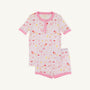 The Beaufort Bonnet Company’s Payton Pajama Shorts Set – Ice Cream Daydream (Strawberry Pink) features a soft cotton jersey children’s pajama set with short sleeves, pink trim, and a delightful dessert-inspired print of cakes, cherries, and ice cream on a white background. This comfy set includes a matching top and shorts for cozy bedtime style.