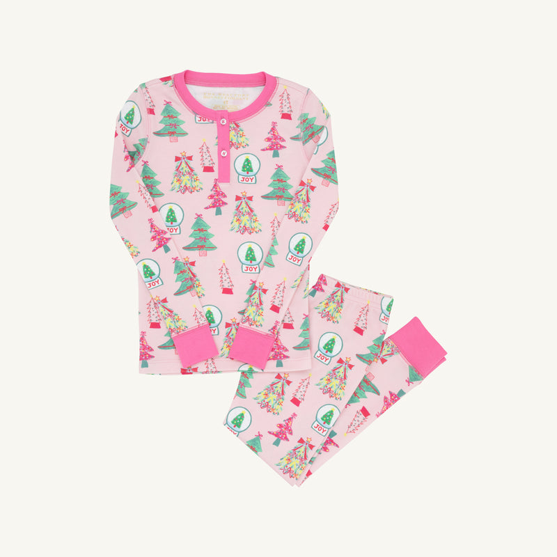 Payton Pajama Set - Christmas Coloring Contest with Winter Park Pink: light pink long-sleeved girls’ pajamas featuring a pattern of snow globes labeled JOY and evergreen trees.