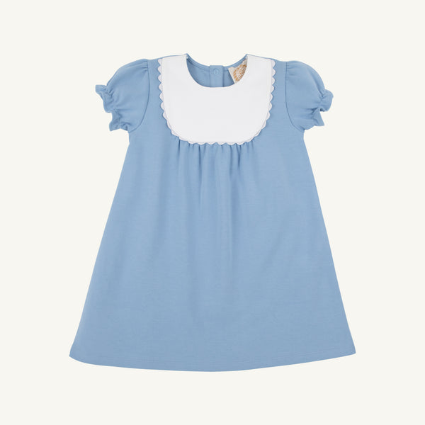 A Pharish Frock in Barrington Blue with Worth Avenue White by The Beaufort Bonnet Company, featuring short sleeves, a white scalloped collar, and gathered fabric below the chest, is displayed on a plain white background.