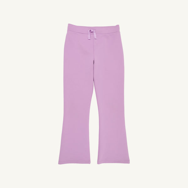 The Beaufort Bonnet Company Prepletic™ Patty Pants in Valley High Violet, featuring a light purple hue, flared bootcut style, and a cute bow at the waistband—shown laid flat on a plain white background, perfect for girls’ activewear.