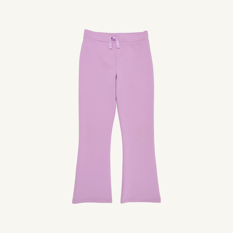 The Beaufort Bonnet Company Prepletic™ Patty Pants in Valley High Violet, featuring a light purple hue, flared bootcut style, and a cute bow at the waistband—shown laid flat on a plain white background, perfect for girls’ activewear.