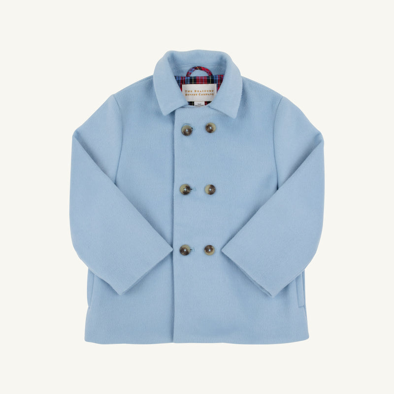A Price Bell Peacoat in Barrington Blue by The Beaufort Bonnet Company, featuring a double-breasted design with large buttons and a plaid lining visible at the collar, displayed on a white background.