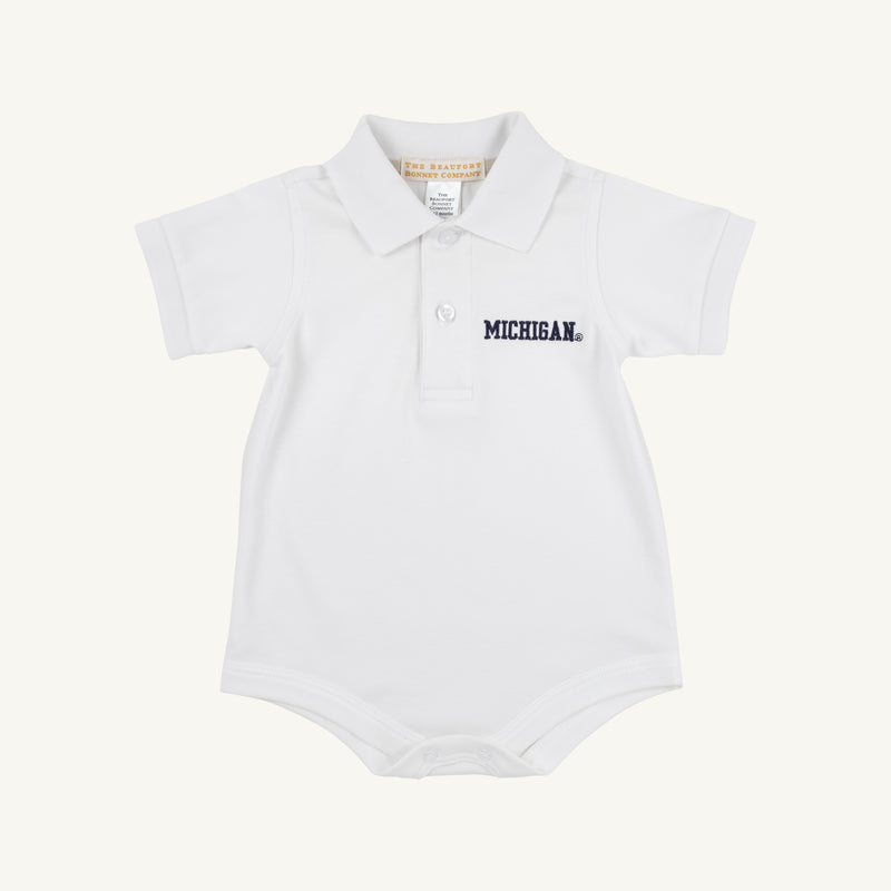 A white baby onesie expertly crafted from soft Pima Cotton Knit, featuring a classic collar, two-button placket, and the Michigan logo embroidered in navy blue on the left chest. Inspired by The Beaufort Bonnet Company’s Michigan Prim & Proper Polo - Worth Avenue White.
