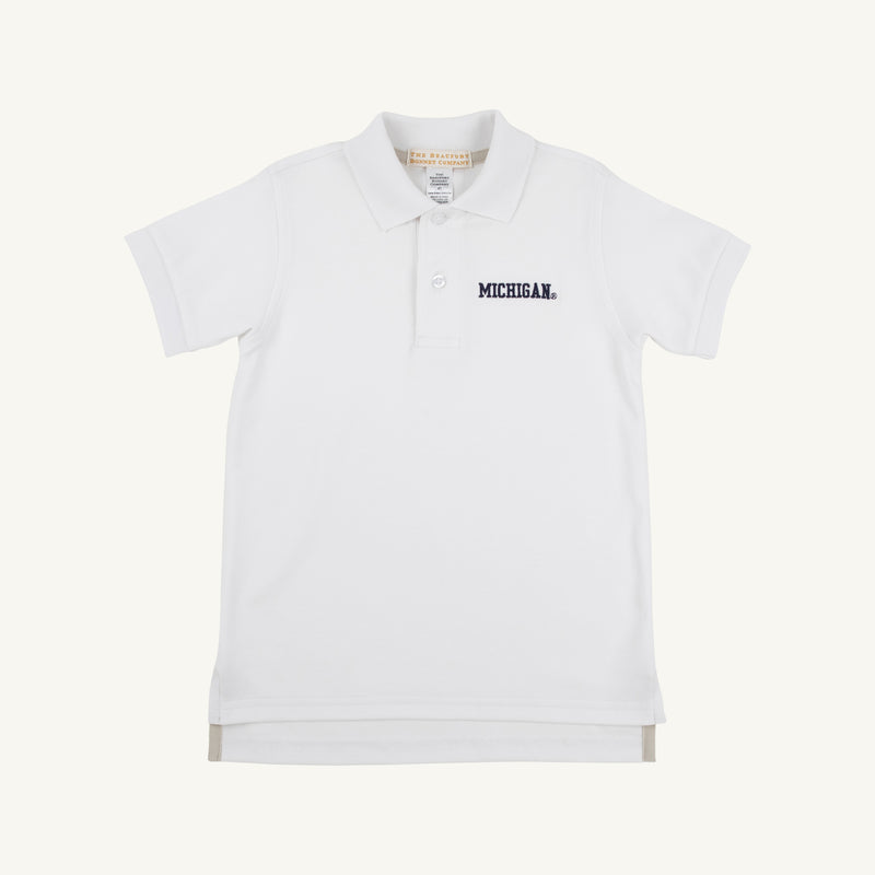 Introducing the Michigan Prim & Proper Polo - Worth Avenue White by The Beaufort Bonnet Company. This classic short-sleeve polo is made from soft Pima Cotton Knit and features a collared neckline with buttons. “MICHIGAN” is embroidered in navy blue on the left chest, showcasing your school pride with timeless style.