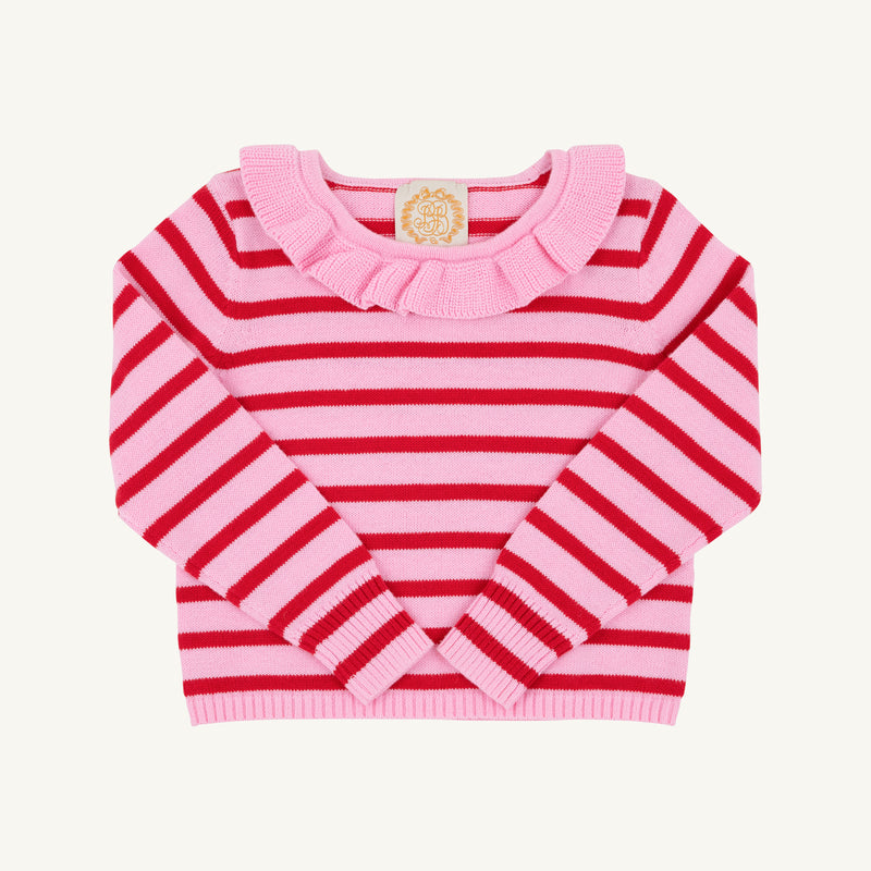 A long-sleeve girls’ sweater by The Beaufort Bonnet Company, the Reece Ruffle Sweater in Pier Party Pink & Richmond Red Stripe, featuring pink and red horizontal stripes and a ruffled pink collar, is displayed laid flat on a white background.