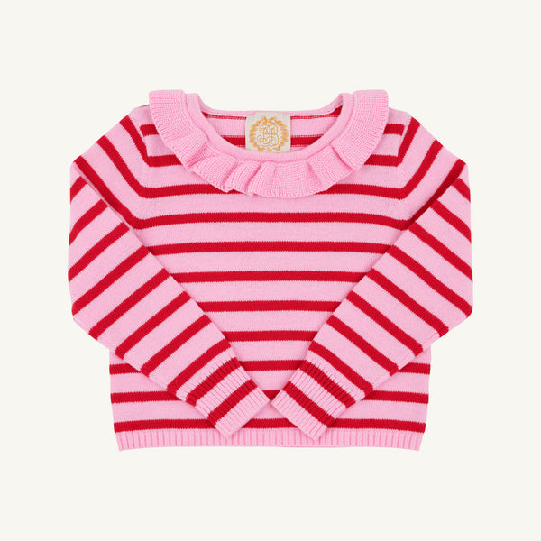 A long-sleeve girls’ sweater by The Beaufort Bonnet Company, the Reece Ruffle Sweater in Pier Party Pink & Richmond Red Stripe, featuring pink and red horizontal stripes and a ruffled pink collar, is displayed laid flat on a white background.