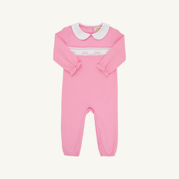 The Beaufort Bonnet Company Rigsby Romper - Hamptons Hot Pink with Worth Avenue White and Bow Smocking featuring a white Peter Pan collar and white bow smocking across the chest.