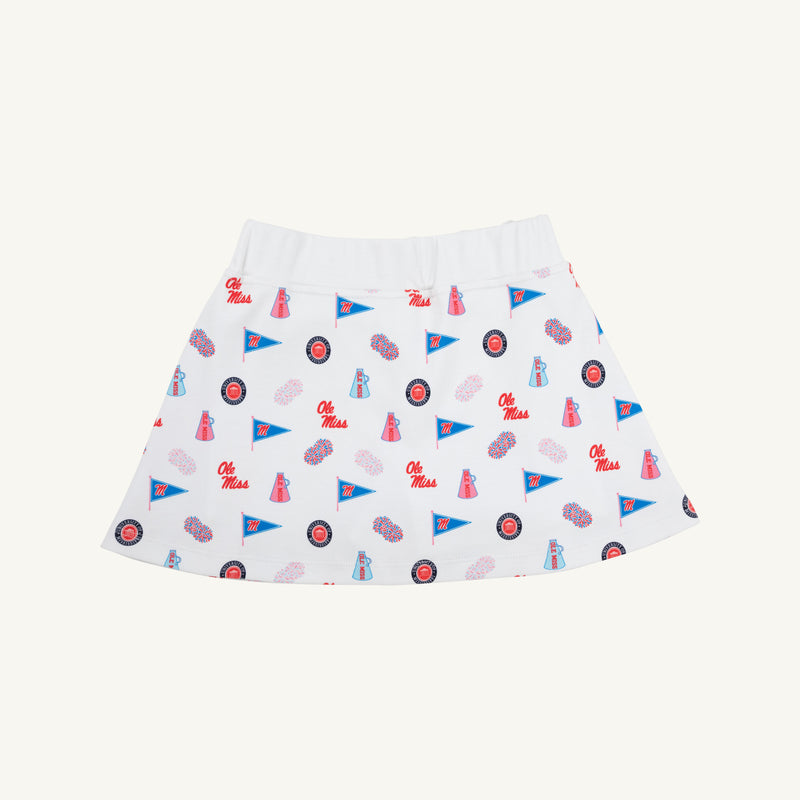 Sure! Here’s the rewritten sentence using your product data: The Beaufort Bonnet Company’s Ole Miss Searcy Skort - Gawsh Almighty with Worth Avenue White is a white Pima cotton skort adorned with an all-over Gawsh Almighty print that showcases red Ole Miss text, blue cheerleader megaphones, mascots, and footballs in vibrant red and blue hues on a crisp background.
