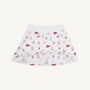 The Alabama Searcy Skort - Sweet Home Honey with Worth Avenue White by The Beaufort Bonnet Company features playful red and pink cheerleader, pom-pom, megaphone, and flag patterns. Made from soft Pima Cotton Knit, this skort offers a wide elastic waistband and attached shorts for added comfort.