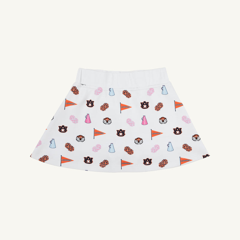 The Beaufort Bonnet Company’s Auburn Searcy Skort - Tiger Thrill with Worth Avenue White features lively Auburn University-themed prints, including logos, tiger mascots, megaphones, pom-poms, and pennants in vibrant orange, navy, pink, and blue hues. This playful skort is perfect for a spirited gameday outfit and is shown here on a neutral background.