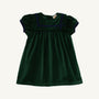 The Beaufort Bonnet Company’s Short Sleeve Patsy’s Party Dress in Grier Green Velveteen with Nantucket Navy features puffed short sleeves, a square yoke, navy blue trim, and gentle pleats for a simple, classic holiday look. The toddler dress is laid flat on a white background.
