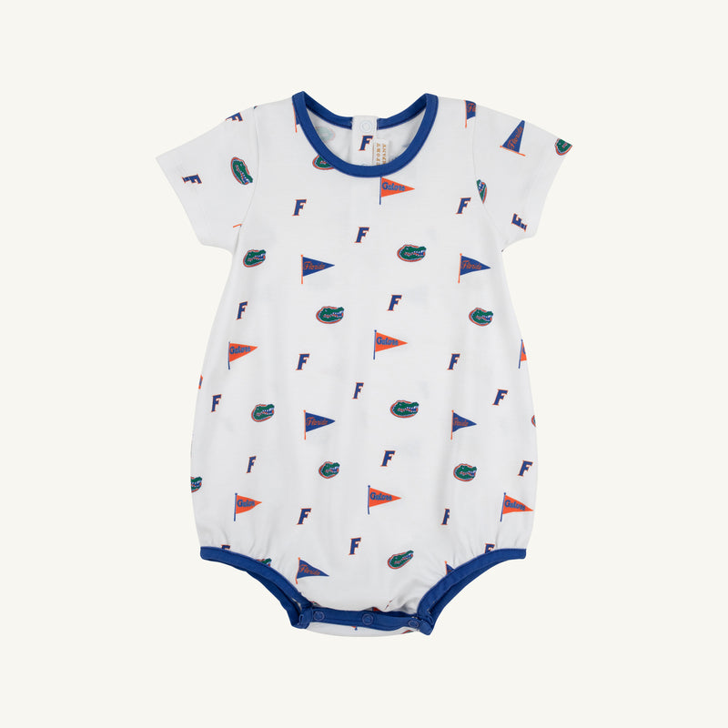 The Beaufort Bonnet Company’s Florida Short Sleeve Patton Play Bubble - Florida Forever with Florida Blue is a white baby romper adorned with a repeating print of small orange and blue flags, F letters, and alligator logos. Made from 100% Pima Cotton for ultimate comfort and softness, this short sleeve bubble features blue trim and convenient snap buttons at the bottom.