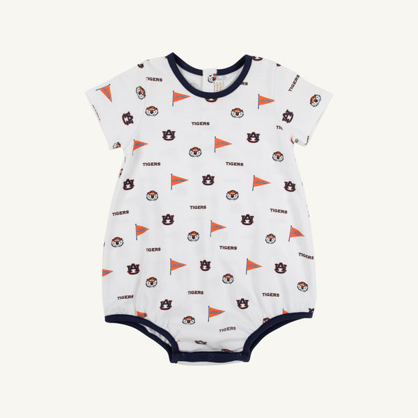 Introducing the Auburn Short Sleeve Patton Play Bubble - Tiger Thrill with Auburn Blue by The Beaufort Bonnet Company: a soft Pima cotton romper for babies featuring playful orange flags, Tigers text, and assorted logo patterns in navy and orange. This adorable bubble is trimmed with navy around the collar, sleeves, and leg openings in the distinctive Tiger Thrill print.