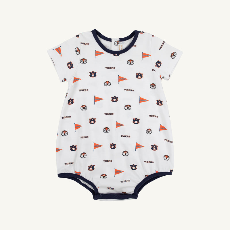Introducing the Auburn Short Sleeve Patton Play Bubble - Tiger Thrill with Auburn Blue by The Beaufort Bonnet Company: a soft Pima cotton romper for babies featuring playful orange flags, Tigers text, and assorted logo patterns in navy and orange. This adorable bubble is trimmed with navy around the collar, sleeves, and leg openings in the distinctive Tiger Thrill print.