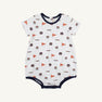 Introducing the Auburn Short Sleeve Patton Play Bubble - Tiger Thrill with Auburn Blue by The Beaufort Bonnet Company: a soft Pima cotton romper for babies featuring playful orange flags, Tigers text, and assorted logo patterns in navy and orange. This adorable bubble is trimmed with navy around the collar, sleeves, and leg openings in the distinctive Tiger Thrill print.