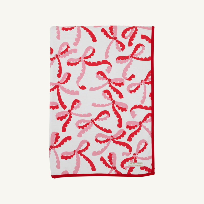 Silent Night Throw - Bonnie Scot Bows with Richmond Red and Hamptons Hot Pink Stripe in soft Pima cotton knit, featuring a red and pink scalloped bow pattern and a solid red border.