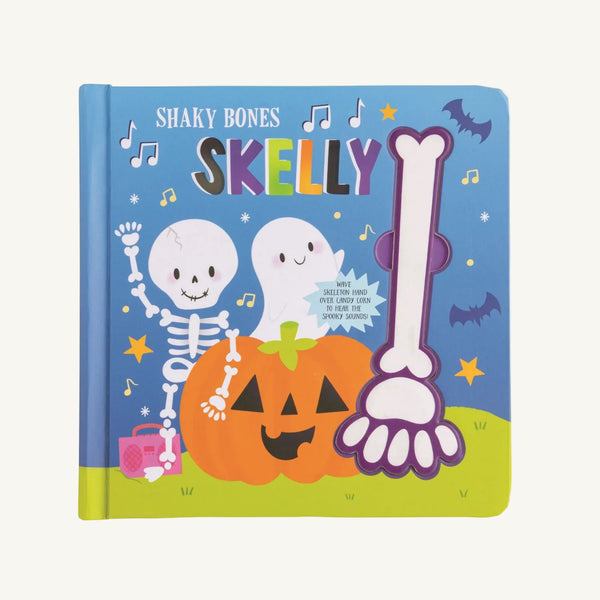 The Beaufort Bonnet Company’s Skelton Halloween Sound Book - Mud Pie features two smiling skeletons, a ghost, a pumpkin, bats, and musical notes on its blue cover with a large bone illustration on the right side. This interactive board book is perfect for Halloween storytime.
