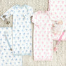 Two baby gowns in Blue Grand Gasparilla Gingham featuring carriage prints, paired with matching blankets, a doll, and two Parker Paci Clip - Blue Grand Gasparilla Gingham with Buckhead Blue sets.